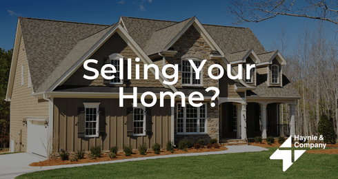Selling your home? Large suburban house with Haynie logo in springtime setting.