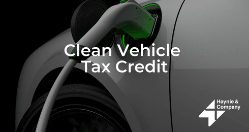 Electric car charging with Clean Vehicle Tax Credit text overlay.