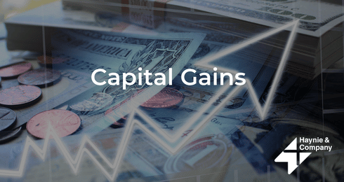 Capital Gains text overlaid on scattered currency and coins with upward graph line, Haynie logo visible.