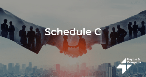 Schedule C text overlaid on handshake with cityscape background, Haynie logo in corner.