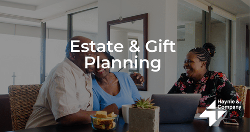 Estate planning consultation with couple and advisor at Haynie office.