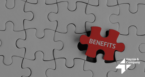 Red puzzle piece with BENEFITS text, fitting into blank pieces with Haynie logo.