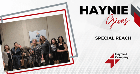 Group of people at Haynie event with Special Reach banner.