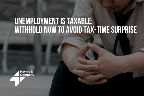 Unemployment is taxable: Man looking concerned, reminder to withhold taxes to prevent surprises at tax time.