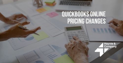People reviewing QuickBooks Online pricing changes with charts and calculator.