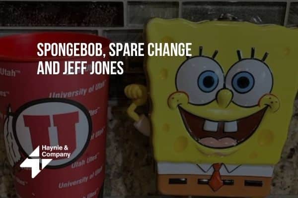 SpongeBob coin bank and University of Utah cup on a countertop.