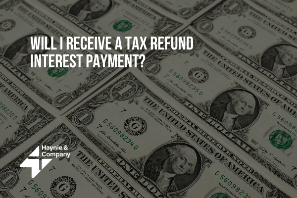 Dollar bills with text asking about receiving tax refund interest payment. Haynie logo present.