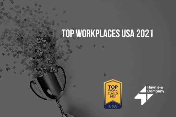 Trophy with stars, Top Workplaces USA 2021, Haynie logo, award badge in grayscale.