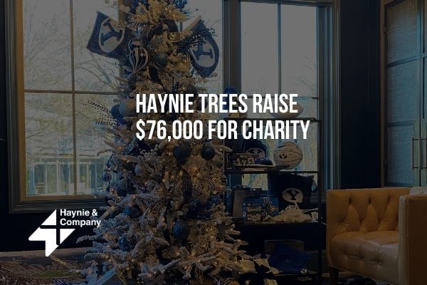 Christmas tree with decorations and Haynie logo raising $76,000 for charity.