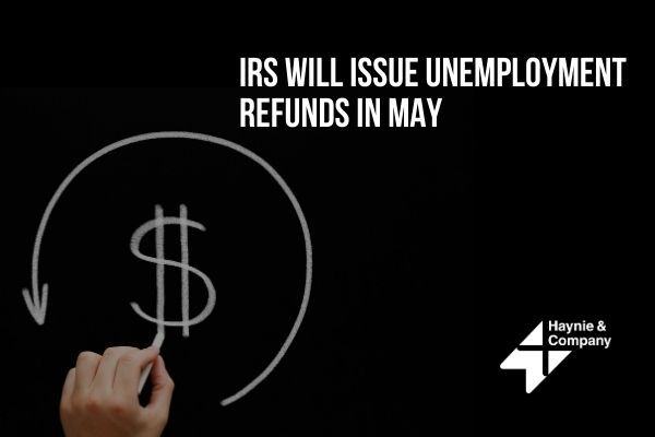 IRS to issue unemployment refunds in May, hand drawing refund symbol.
