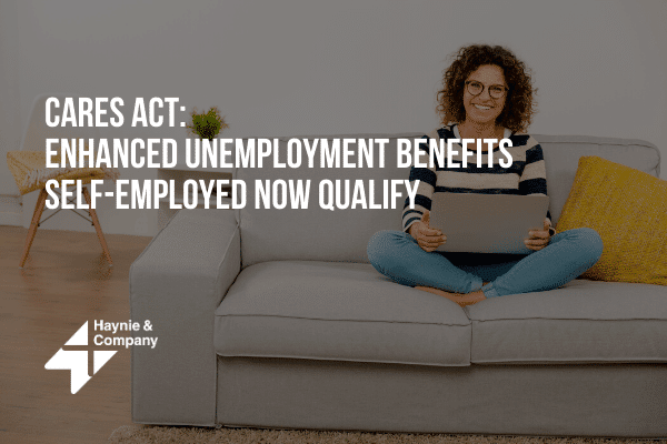 Woman sitting on a couch with a laptop, promoting CARES Act benefits for self-employed.