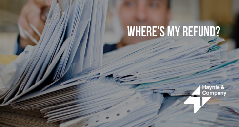 Stacks of papers with WHERE'S MY REFUND? text and Haynie logo.