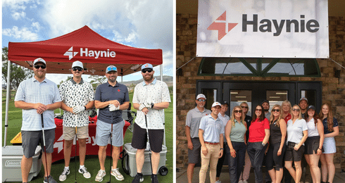 Haynie team at golf event under branded tent and group of people posing in front of Haynie banner.