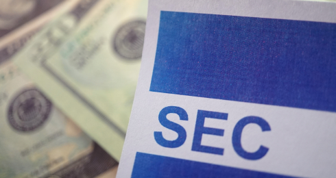 SEC document and money in background, financial regulation concept.